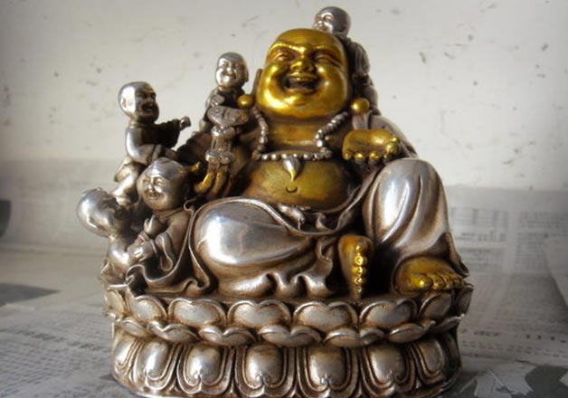 different types of laughing buddha statues