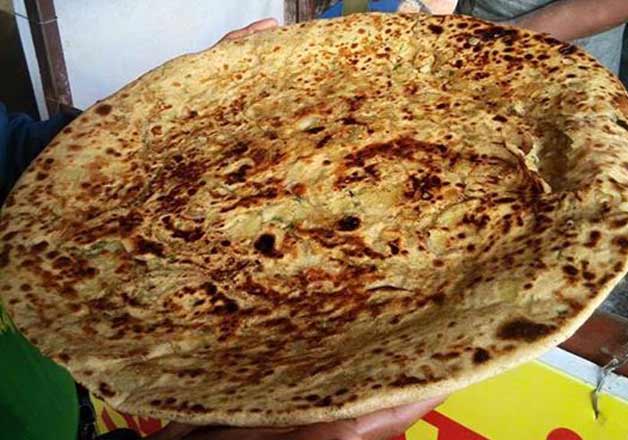 Delhi-eatery challenges customers to eat 3 parathas weighing1kg in 50 ...