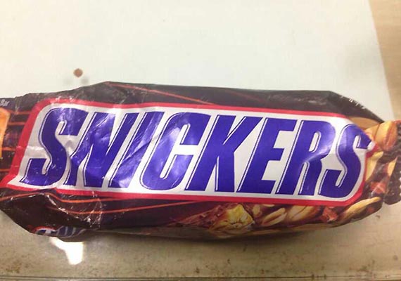 Smuggler held in Mumbai with gold biscuits concealed inside Snickers ...